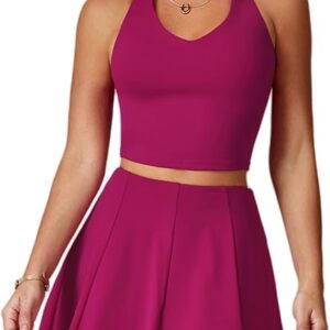 An athletic woman wearing a two-piece tennis set featuring a v-neck halter tank top and pleated skirt.