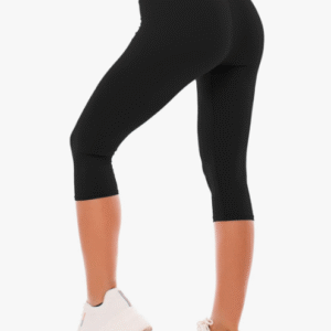 A woman feeling confident and supported in a pair of high-waisted workout leggings.