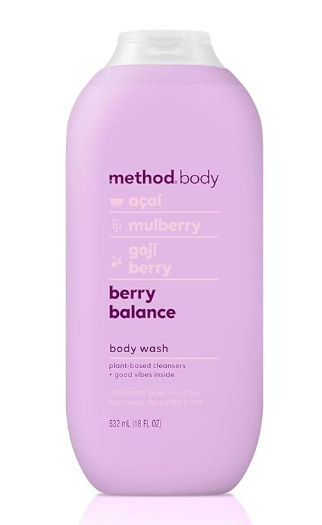 A bottle of Method Berry Balance body wash with fresh berries, highlighting its natural, skin-friendly formula.