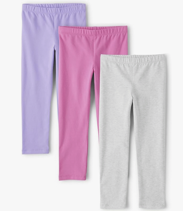 Toddler girl playing happily in a pair of soft, solid-color leggings from The Children's Place multipack.
